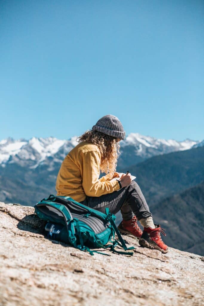 Writing a postcard (Photo by Tyler Nix on Unsplash)